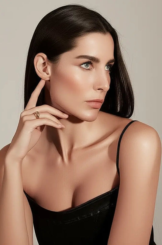 Woman wearing a black dress with a neutral background