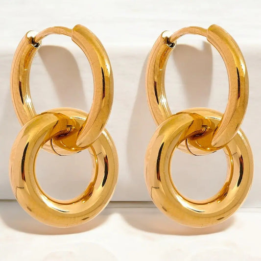 Pair of gold hoop earrings on a white background