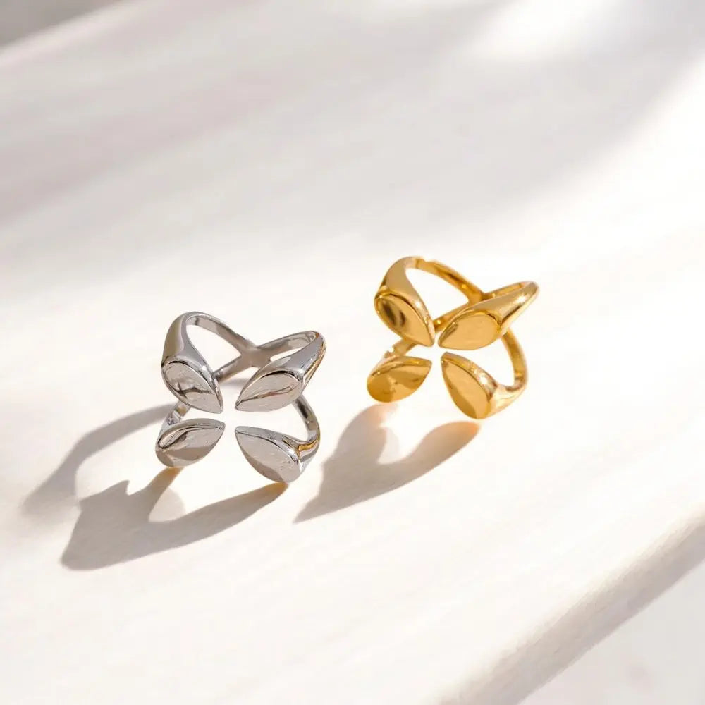 Two gold and silver rings on a light background