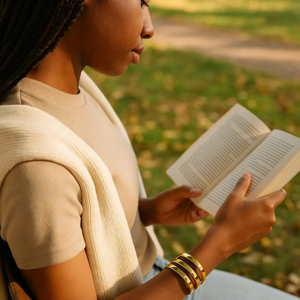 Woman reading a book outdoors in a park