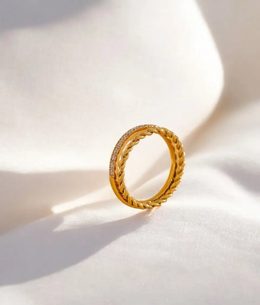 Gold ring on a light background