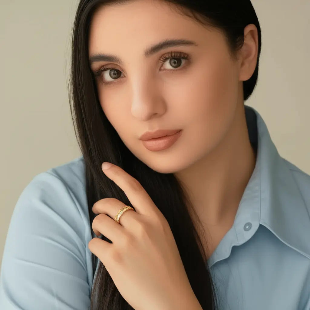 Woman wearing a light blue shirt with a neutral background
