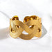 Gold bracelet with a braided design on a white background