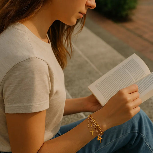 Woman reading a book outdoors with a warm, blurred background