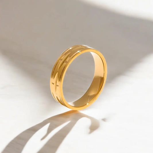 Gold ring on a light background
