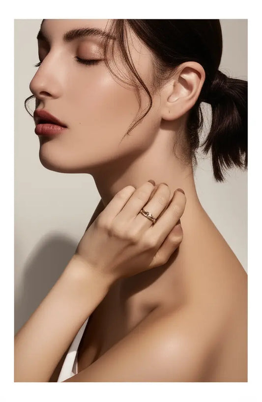 Woman wearing a ring on her hand with a neutral background