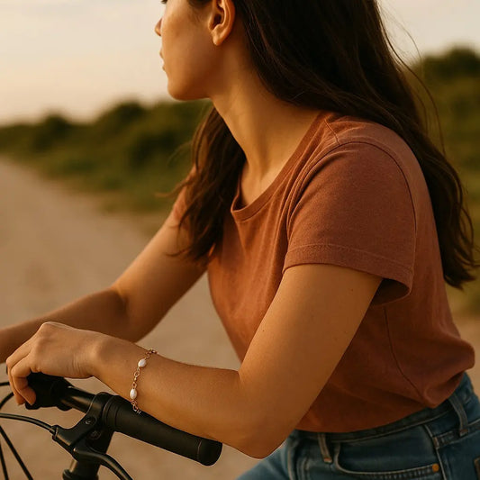Person riding a bicycle on a path with a blurred natural background