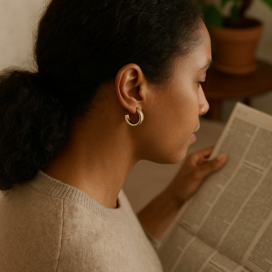 Woman reading a newspaper with a warm indoor setting