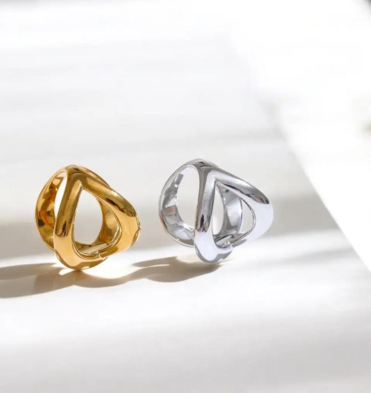 Gold and silver rings on a light background