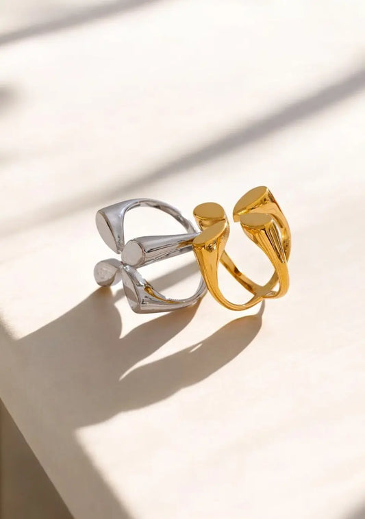 Gold and silver rings on a light background