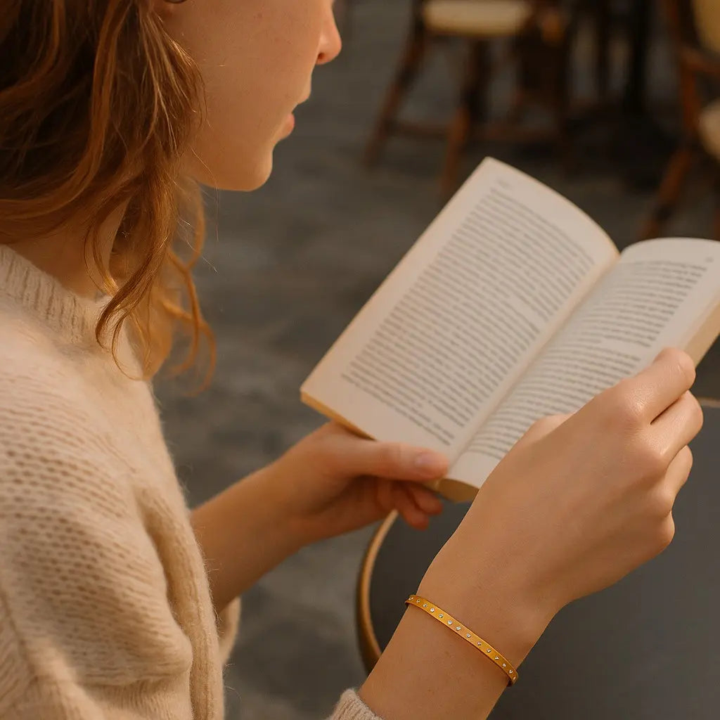 Person reading a book with a blurred background