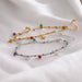 Two bracelets with star and bead details on a white surface