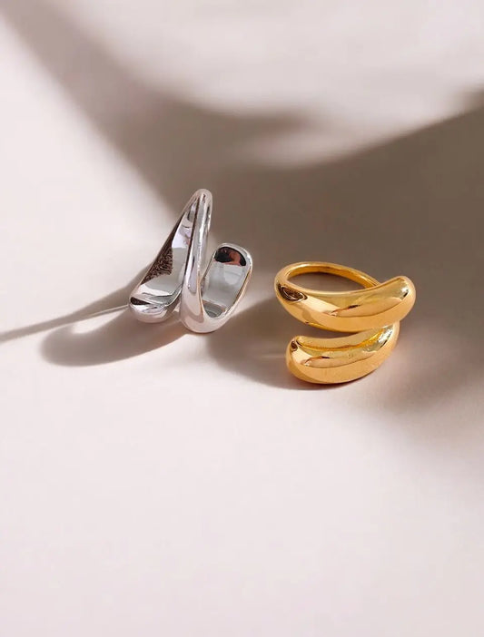 Gold and silver rings on a light background