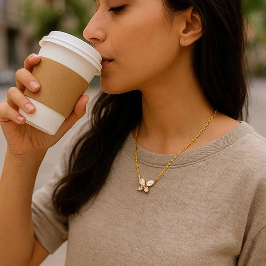 Woman drinking from a coffee cup outdoors
