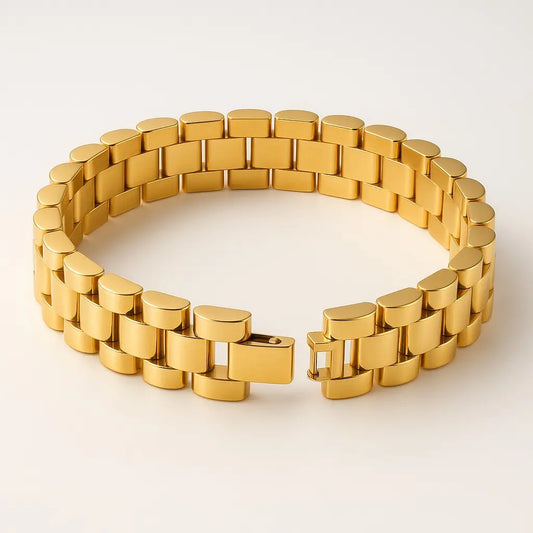 Gold chain bracelet on a light beige background