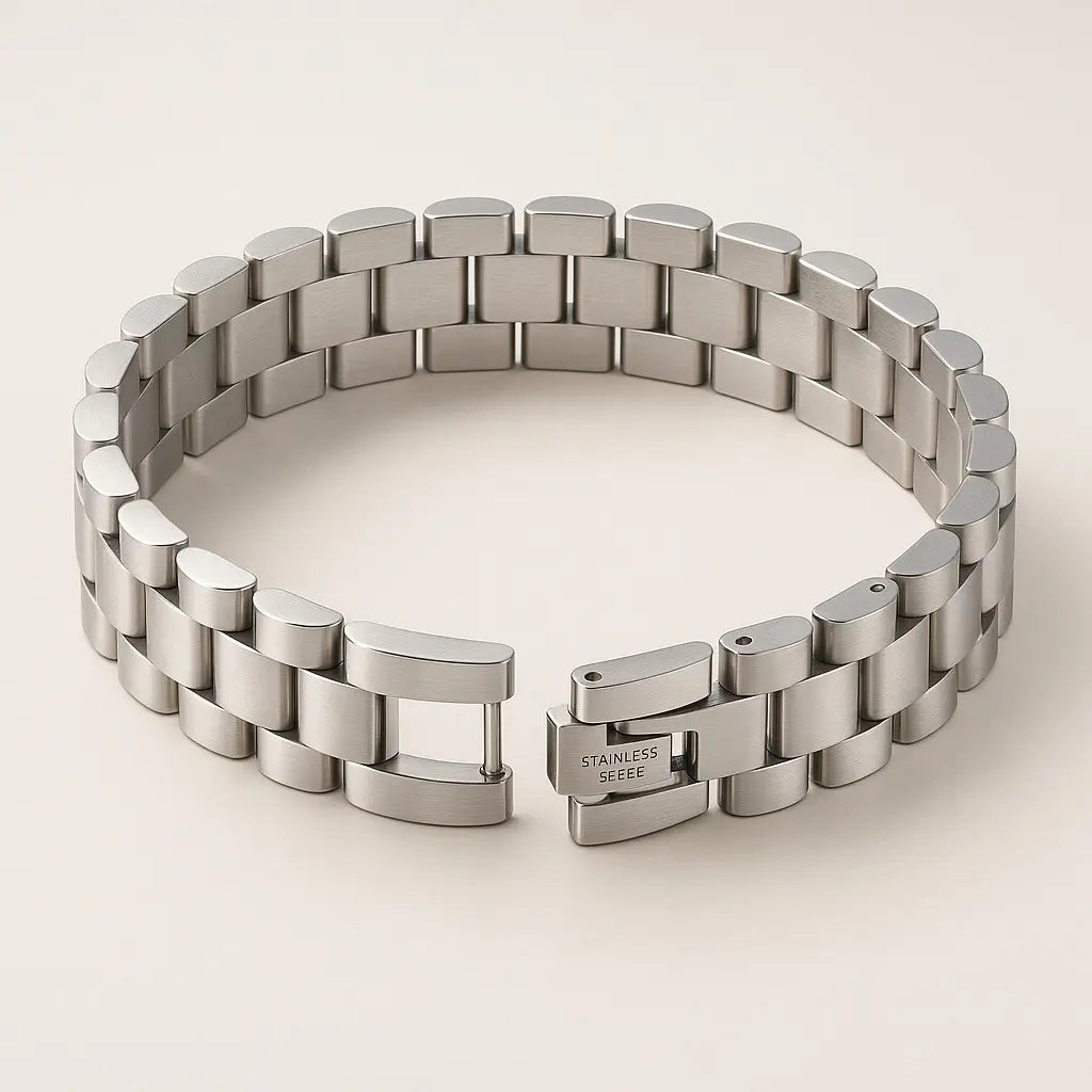 Silver metal bracelet on a light beige background