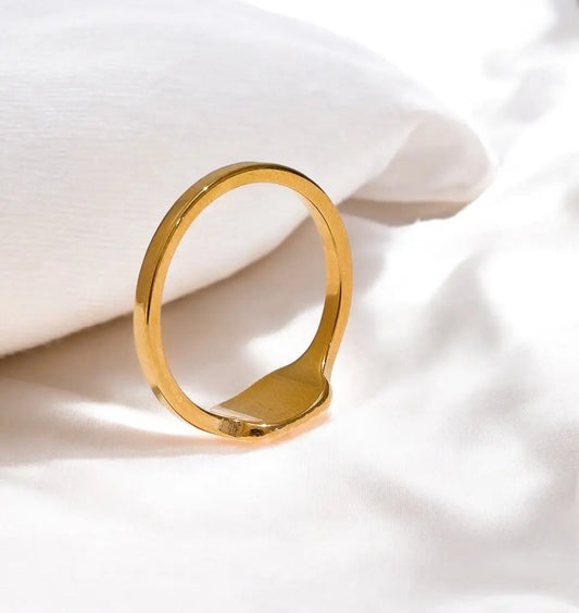 Gold ring on a white background