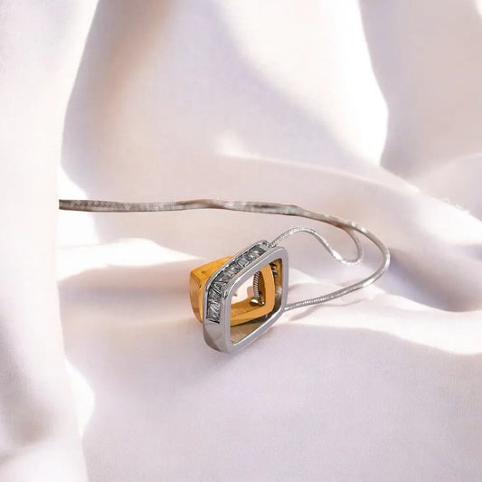 Gold and silver ring on a white fabric background